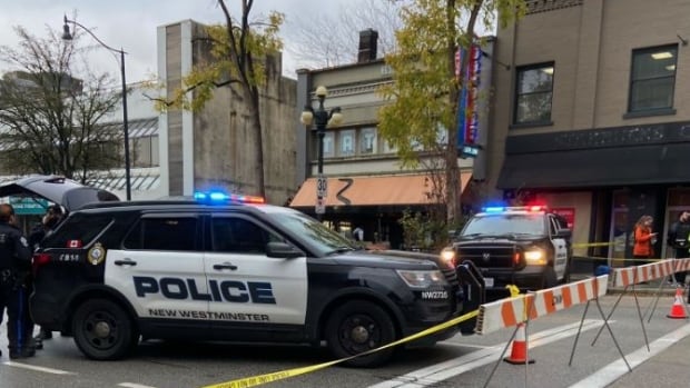 Yellow tape is up on a New Westminster street after a man is found dead in a coffee shop.