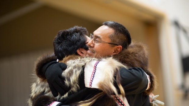Family in Aklavik, N.W.T., hopeful after minister says Indigenous people have right to move freely; Herman Oyagak \(R\) embraces his wife, Carol Oyagak\. Herman, an Inupiaq man living in the N\.W\.T\., is facing deportation to Alaska on December 13, 2021\.