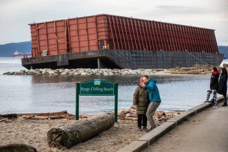 Park board installs 'Barge Chilling Beach' sign next to