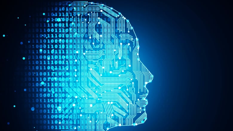 A graphic of a human face formed by lit-p computer circuits.