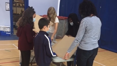Students building air filters