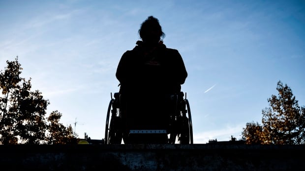 Stock photo of a woman in a wheelchair.