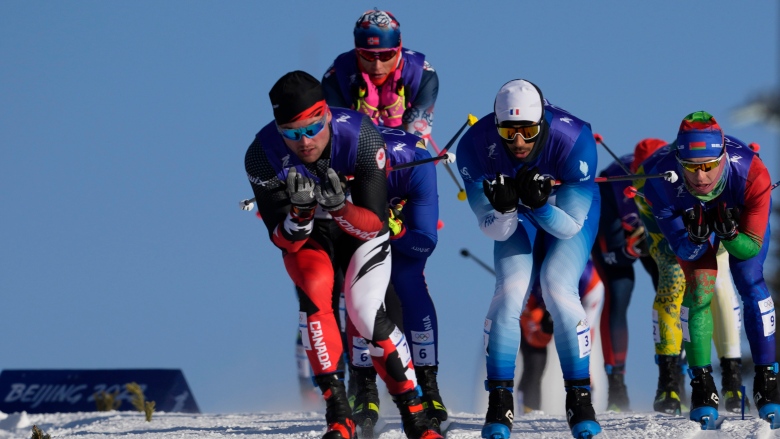 WATCH | Gatineau's Antoine Cyr, with Graham Ritchie, races to historic cross-country Olympic finish in Beijing; Graham Ritchie of Canada competes during the men's team sprint classic cross-country skiing competition at the 2022 Winter Olympics on Wednesday in Zhangjiakou, China. 