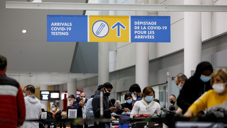 Federal government to end pre-arrival COVID testing for travellers entering Canada; Travellers walk through Pearson airport in Toronto on Dec. 16, 2021.
