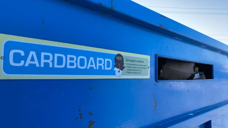 A closeup of a recycling blue bin for cardboard in Yellowknife.