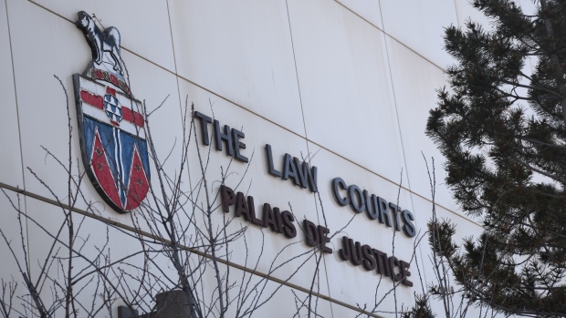 Crown ordered to pay after making legal errors, racist statements during Yukon sexual assault trial; A close-up of the signage on the courthouse in Whitehorse\. 