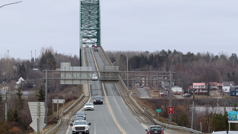 centennial bridge with cars approaching ramp
