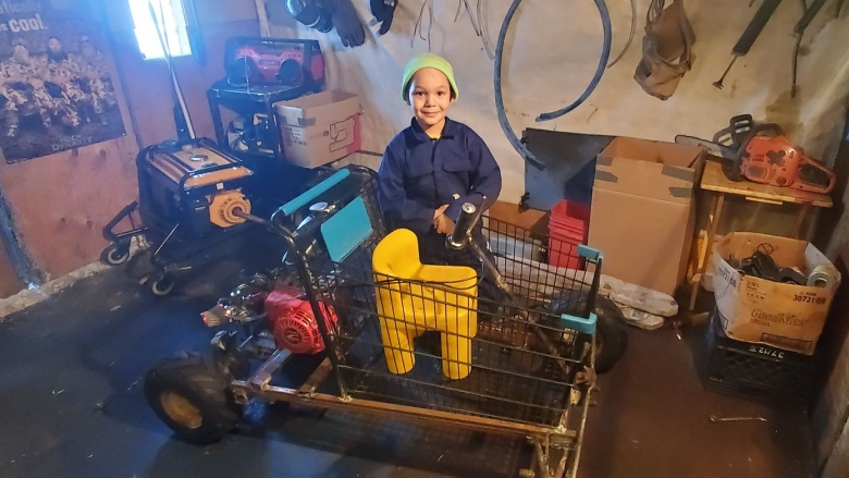 This 7-year-old boy and his dad in Pond Inlet are building a go-kart from scraps; 
