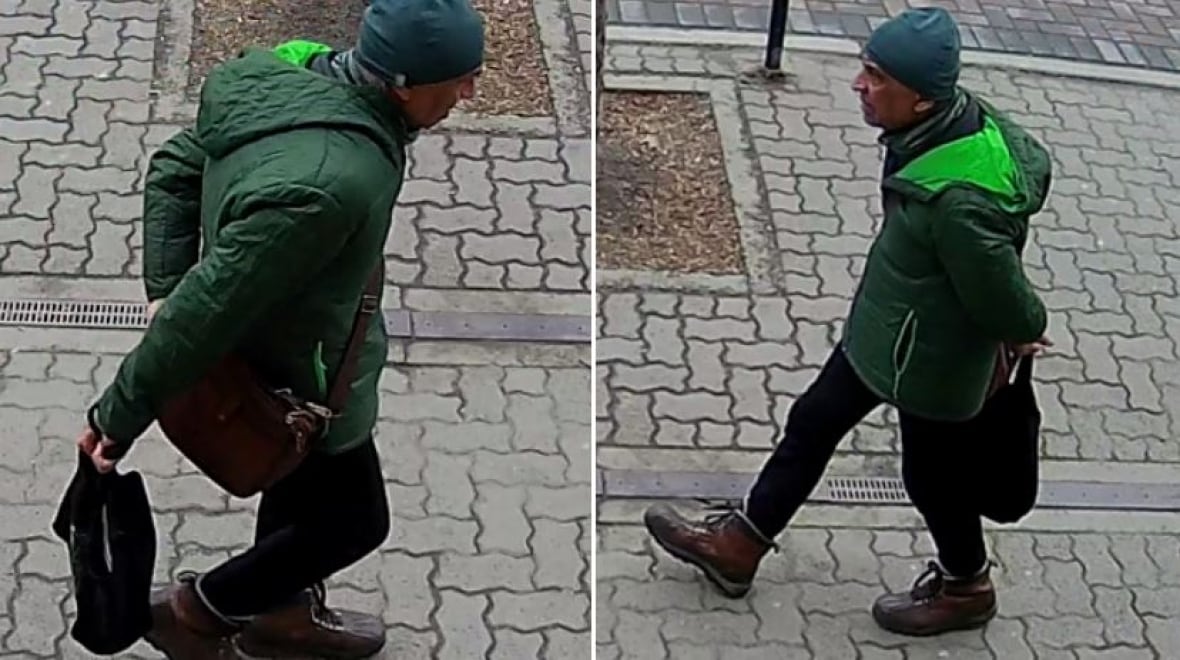 A man wearing a green jacket walks on a pavement wearing green.