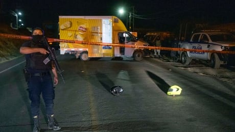 Members of the National Guard and soldiers of the Mexican Army patrol the surroundings of a venue where illegal cockfights take place after killings took place Sunday night in Zinapecuaro, Michoacan. 1239570729