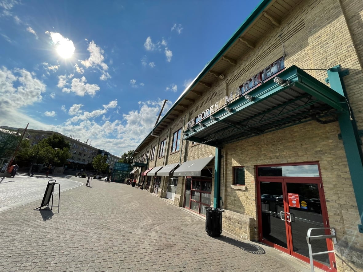 Outside of a building with a wide sidewalk.