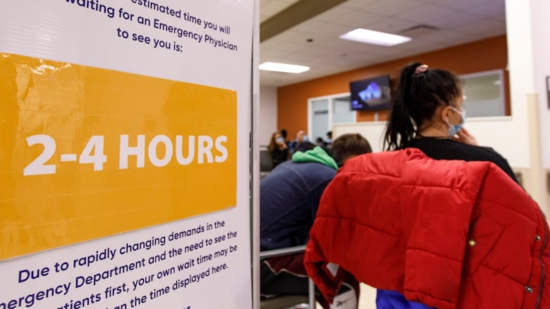 A sign, indicating the estimated wait time at Humber River Hospital, is pictured in the emergency department in Toronto on April 26. The hospital is facing higher patient volumes, and a rise in flu cases.