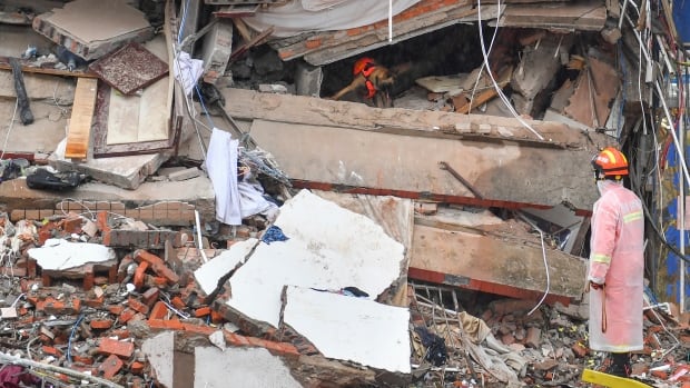Police arrest 9, dozens still missing or trapped after building collapses in China