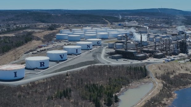 Record prices for all diesel fuels including diesel, furnace oil and jet fuel have been generating major financial returns for refineries in eastern North America. The Irving Oil refinery in Saint John is the major supplier of diesel products in Atlantic Canada and the northeast U.S. An overhead shot of an oil refinery, with a variety of storage tanks. Six in a row in the foreground are white with letters spelling out "Irving" between them in dark letters.