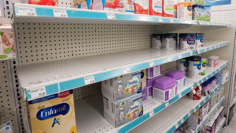Baby formula packages on shelves