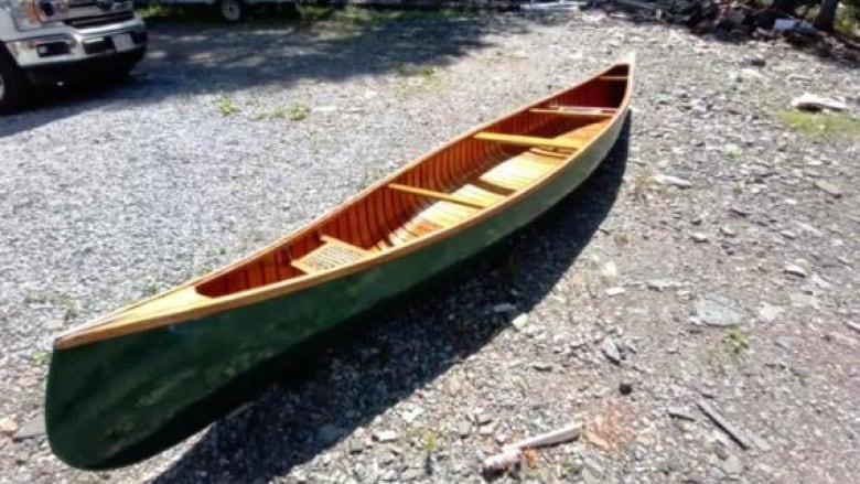 Blue Canoe 1920's Chestnut Wood and Canvas Canoe