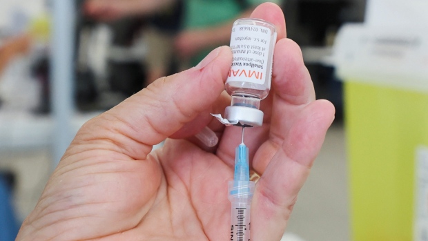 Toronto increases mpox vaccine slots amid concerns over access; A health-care worker prepares a syringe filled with the monkeypox vaccine in Montreal