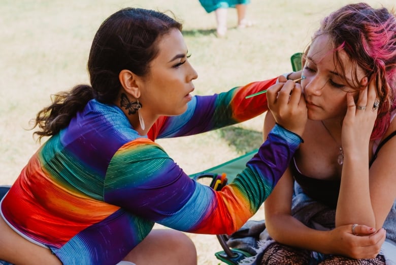 Harmony Scott left does makeup for Syd Tacknyk as part of the celebrations for National Indigenous Peoples day in Kenora Ont on June 21 2022 