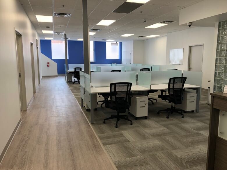 Desks and chairs within a workspace.
