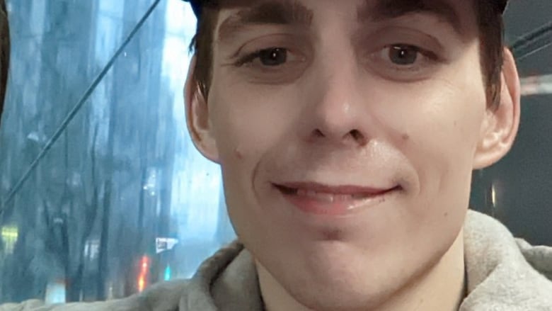 Photo of a man wearing a baseball cap