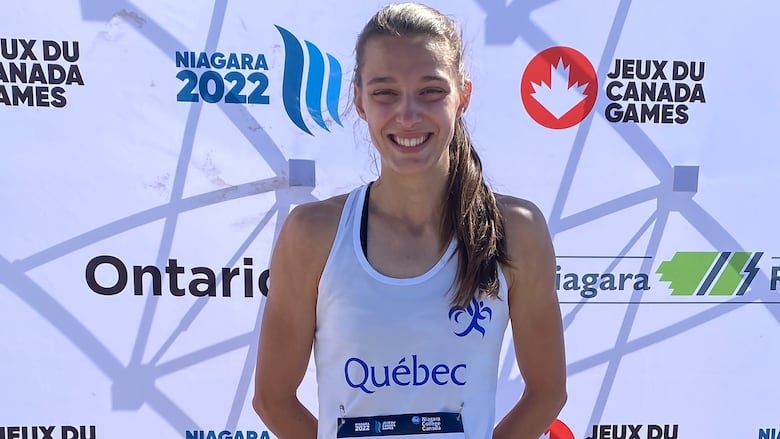 Canadian women's sprinter stands on the podium after winning gold medal at 2022 Canada Games.