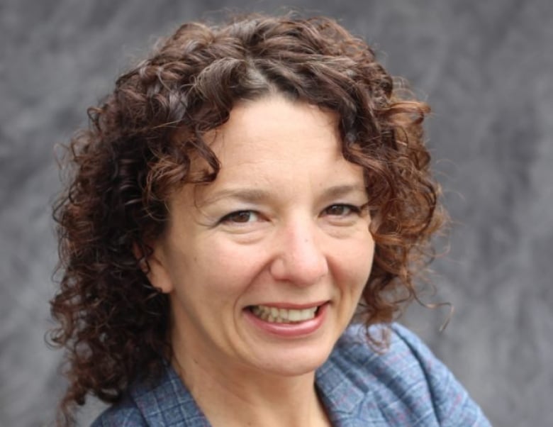 Portrait of woman with curly hair.