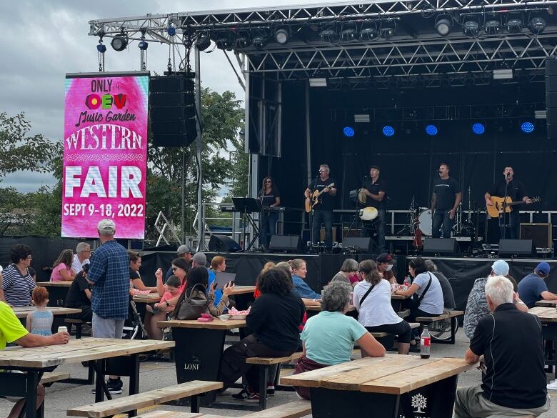 A band plays on a stage.