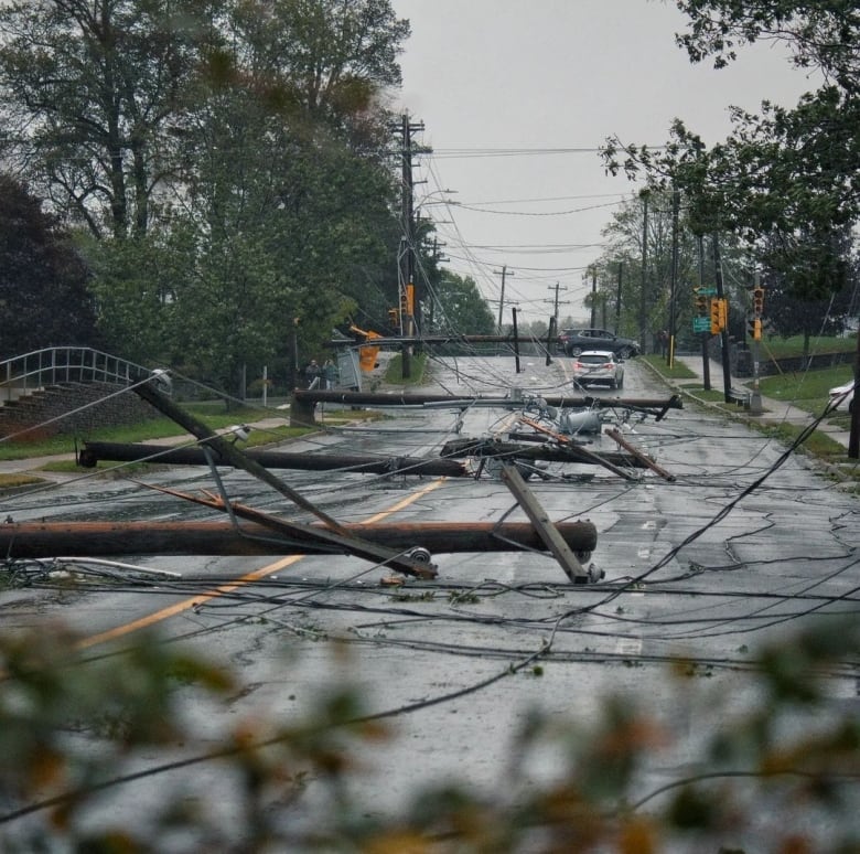 Joshawa Tyler LaVoie captured this striking image of downed power lines and poles on Woodlawn Road in Dartmouth.