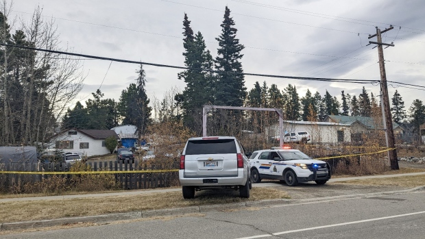 Police watchdog clears RCMP officer involved in Whitehorse shooting incident; Police vehicles and tape cordon off a home in Porter Creek after a shooting that left the suspect and one RCMP officer wounded\. Sheldon Keobke, 35, faces 15 charges in connection with the incident\.