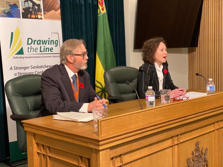 The director of the province's Constitutional Law Branch, Mitch McAdam (left), and Saskatchewan Justice Minister Bronwyn Eyre (right) take questions regarding the Saskatchewan First Act and its related amendments aimed to outline provincial jurisdiction over natural resources.