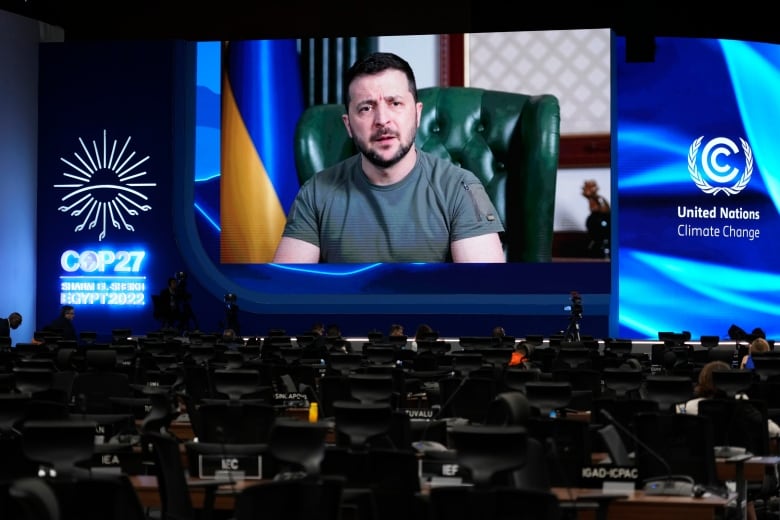 Ukrainian President Volodymyr Zelenskyy speaks via video at the COP27 UN climate summit in Sharm el-Sheikh, Egypt, on Tuesday. (Peter Dejong/The Associated Press)