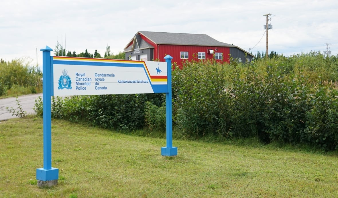 Red building with RCMP detachment sign in front of it