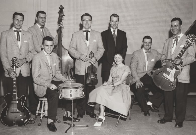 A black and white photo of a group of musicians.