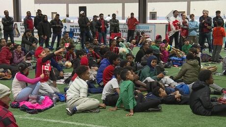 People gathered at the indoor soccer field at the Genesis Centre in Calgary to watch Canada's men's soccer team play in the World Cup on Sunday. world cup watch party calgary