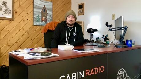 Cabin Radio's editor and part-owner, Ollie Williams, at Cabin Radio's newsroom in Yellowknife. The company applied to the Canadian Radio-television and Telecommunications Commission (CRTC) for a commercial FM licence in August of 2019, but the application has yet to be approved or denied. Ollie Williams