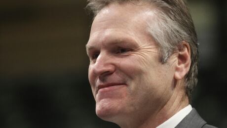 Gov. Mike Dunleavy smiles while talking to legislators after his inauguration ceremony on Dec. 5 in Anchorage, Alaska. Dunleavy, a Republican, last month became the first Alaska governor since Democrat Tony Knowles in 1998 to win back-to-back terms. Alaska Governor