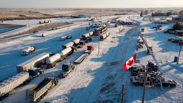 'Our last stand': Murder-conspiracy trial sees phone texts from Coutts blockade; A truck convoy of anti-COVID-19 vaccine mandate demonstrators block the highway at the busy U\.S\. border crossing in Coutts, Alta\., in February of this year\.