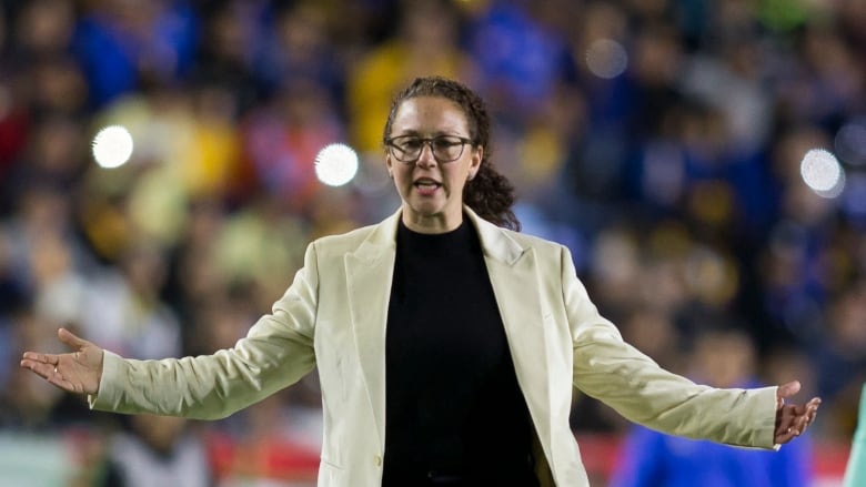 Tigres UANL Femenil coach Carmelina Moscato gestures with both arms spread out wide during the women's Liga MX Apertura 2022 final football match.