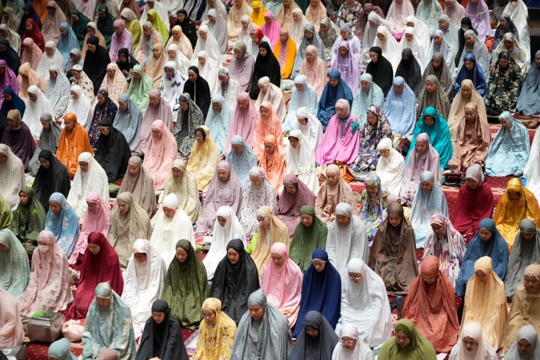 Muslim women pack a mosque for an evening prayer called 'tarawih' that marks the first eve of the holy fasting month of Ramadan.