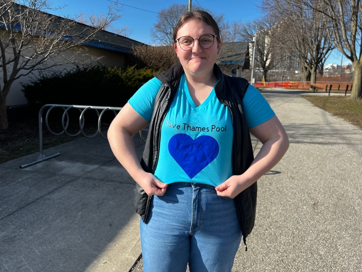 Nicole Phillips is the president of Old South Community Organization in a blue T-shirt saying "Save Thames Pool"
