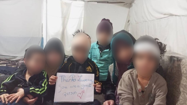 Mother of six Canada refused to repatriate has died in Turkey, lawyer says; The six children of a Quebec women detained in a northeastern Syrian camp for families of those with suspected ISIS ties holding a sign thanking their mother's lawyer Lawrence Greenspon for his efforts to get them to Canada\.