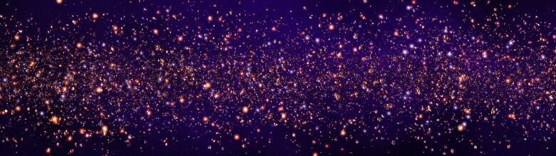 A purplish background filled with bright lights that look like stars in the night sky.