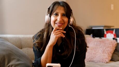 Farrah Jinha is part of a growing trend of people representing themselves in court. She is pictured in her Toronto condo on April 17, 2023.