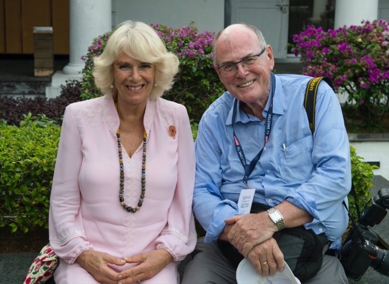 Arthur Edwards sits alongside Camilla, then the Duchess of Cornwall, during a break from a Royal visit to Indonesia in 2017.