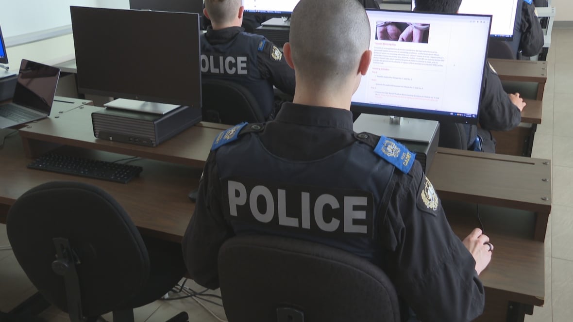 Police students sit at computer in classroom at the Atlantic Police Academy.