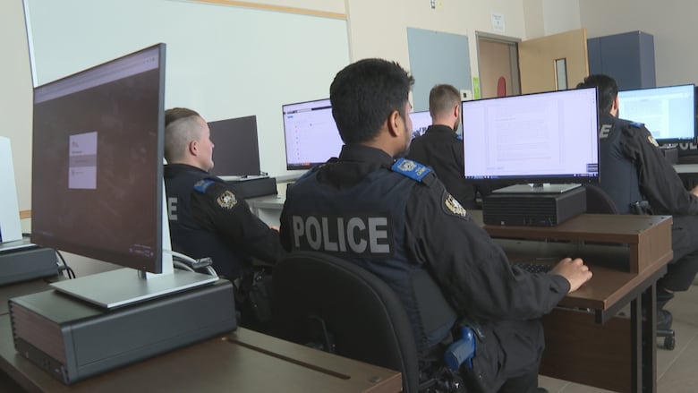 Students on computers at the Atlantic Police Academy.