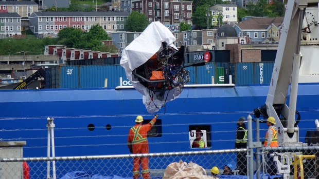 1 year after submersible implosion, Titanic expeditions must continue, says N.L. adventurer; Wreckage from the Titan is hoisted from the ship that brought it back to St\. John's harbour Wednesday morning\.