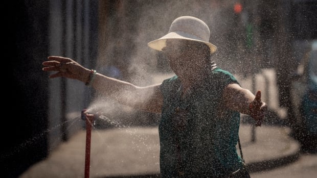 A woman at a misting station. 