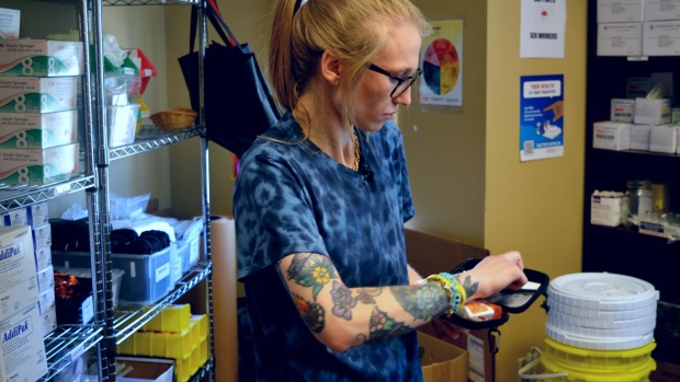 Drug safety advocacy group says tainted cocaine is Newfoundland's new reality; Emily Wadden, a program manager with the Safe Works Access Program in St\. John's, shows reporters the contents of a naloxone kit\.