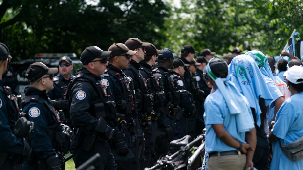 Clashes at Toronto Eritrean festival send 9 to hospital, shut local roads; Toronto Police hold back a line of protestors in Earlscourt Park in Toronto, on Saturday, August 5 2023\. Toronto police say one person was stabbed and eight others were injured during a protest in the city’s west end\. 
